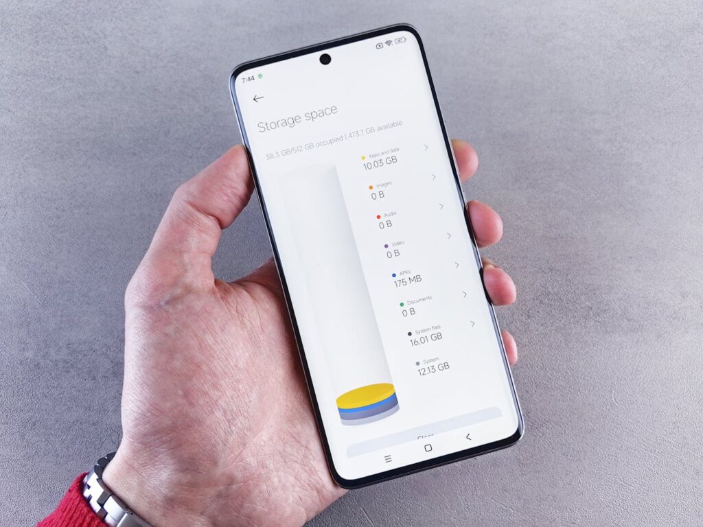 a person showing  a phone's storage